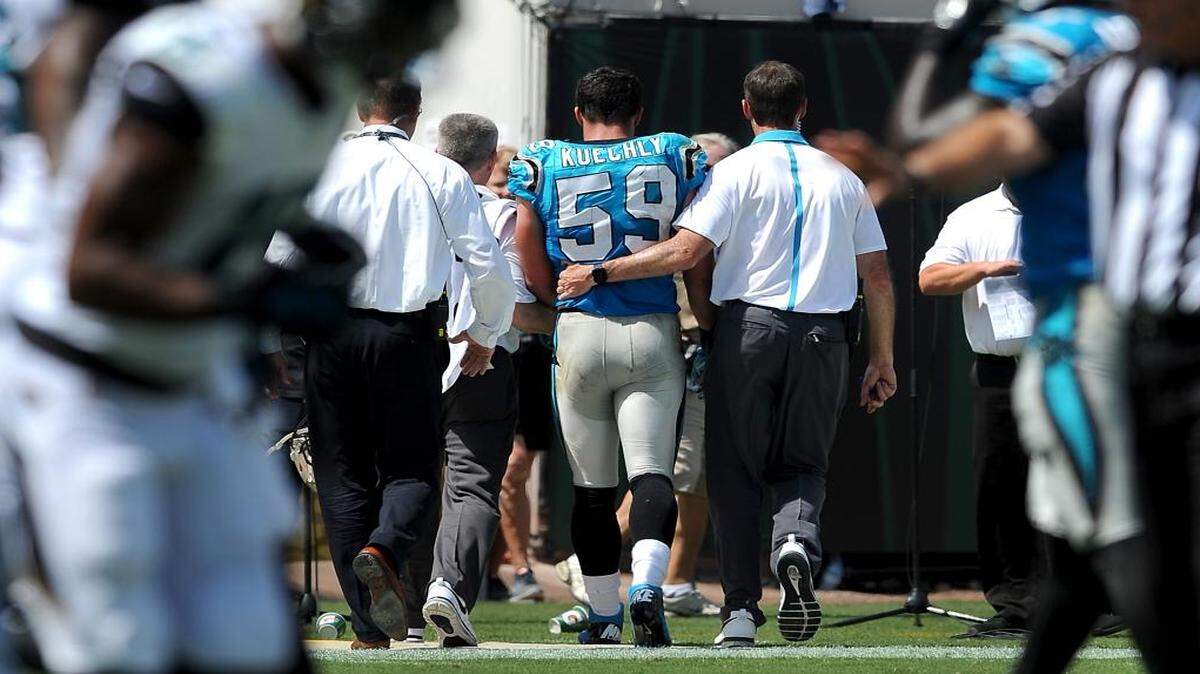 
Carolina Panthers linebacker Luke Kuechly (59) is helped off the field after sustaining a concussion during second quarter action on Sunday, September 13, 2015 at EverBank Field in Jacksonville, Fl. Kuechly sustained a concussion on the play and is now in the NFL's concussion protocol.

