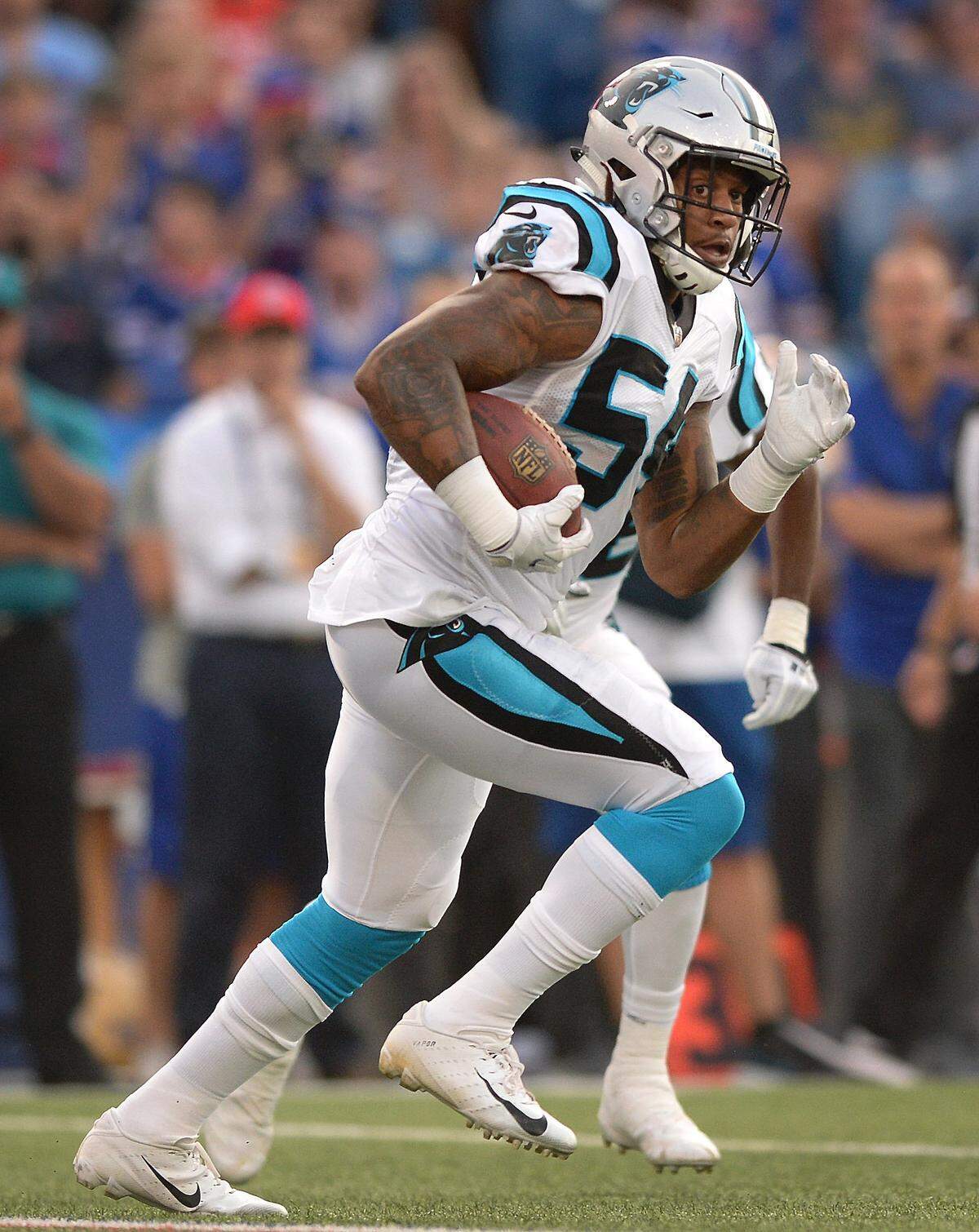 Carolina Panthers linebacker Shaq Thompson looks for an opening to run after intercepting a pass by the Buffalo Bills during NFL exhibition action at New Era Field in Orchard Park, NY on Thursday, August 9, 2018.