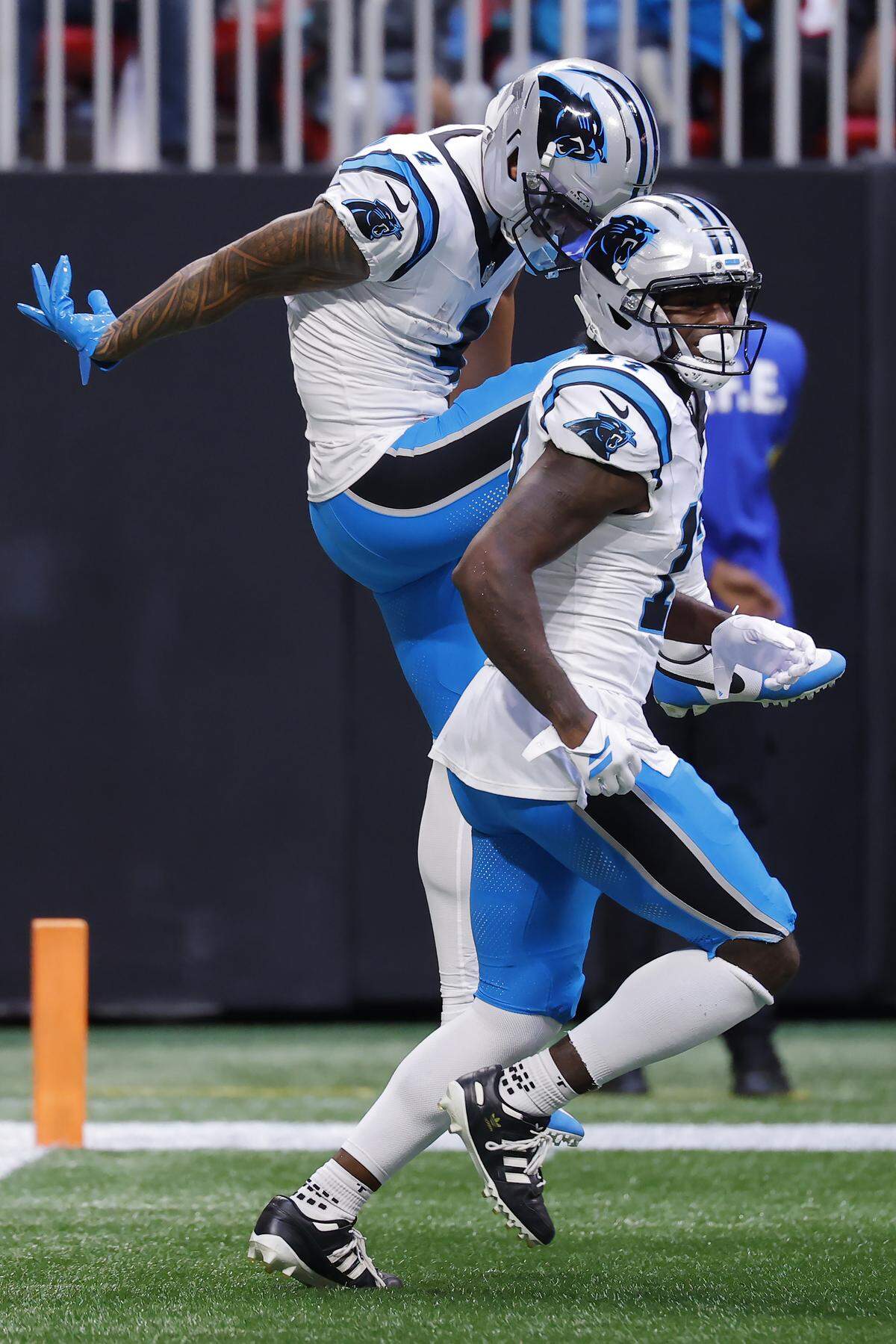 Carolina Panthers wide recevier Xavier Legette (right) celebrates a touchdown with Tetairoa McMillan (left) during the third quarter against the Atlanta Falcons at Mercedes-Benz Stadium on November 16, 2025 in Atlanta, Georgia. (Photo by Todd Kirkland/Getty Images)
