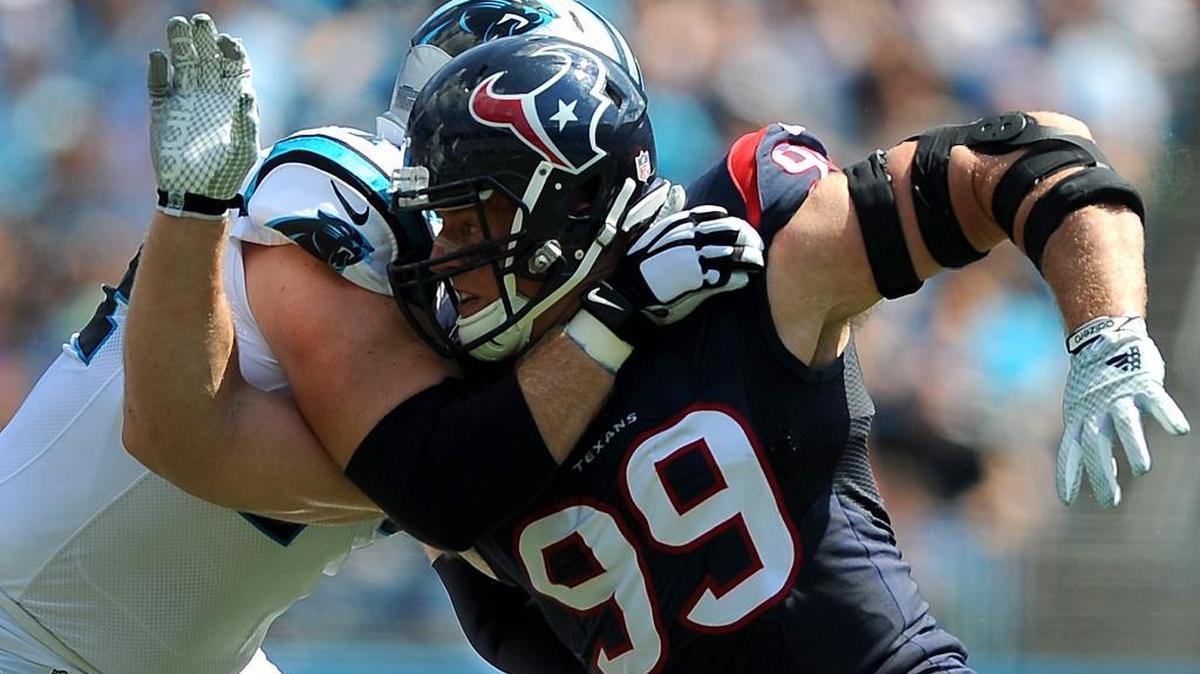 
Carolina Panthers tackle Mike Remmers, left, blocks Houston Texans defensive end J.J. Watt, right, during first quarter action at Bank of America Stadium in Charlotte on Sunday. The Panthers defeated the Texans 24-17.
