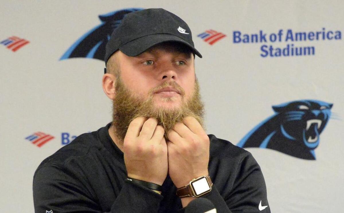 Carolina linebacker Ben Boulware grabs the beard that he believes has helped him become the “hottest ugly guy” on the Panthers.