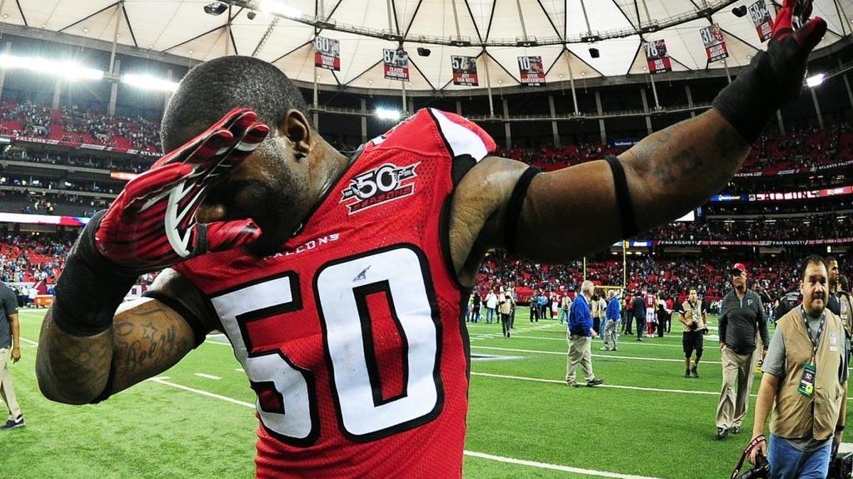 O’Brien Schofield of the Atlanta Falcons dabs before running off the field after beating the Carolina Panthers at the Georgia Dome on Sunday.