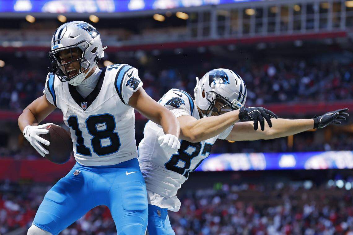 Carolina Panthers wide receiver Jalen Coker (left) celebrates a two point conversion with Brycen Tremayne (right) during the fourth quarter against the Atlanta Falcons at Mercedes-Benz Stadium on November 16, 2025 in Atlanta, Georgia. (Photo by Todd Kirkland/Getty Images)