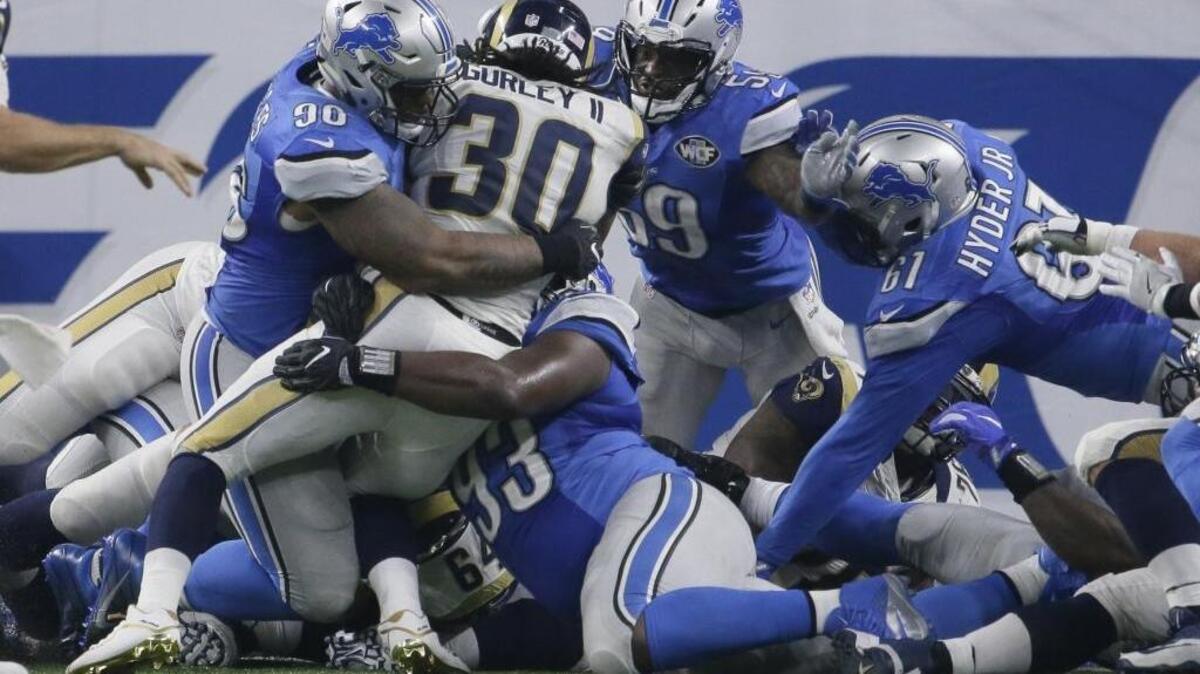 A substandard offensive line and defenses that stack the line of scrimmage have made for tough sledding for second-year Los Angeles Rams running back Todd Gurley (30) this season.