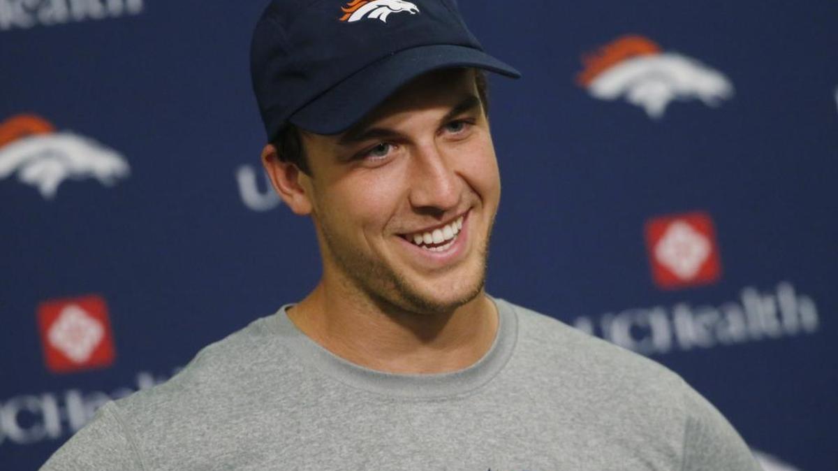 Denver Broncos quarterback Trevor Siemian jokes with reporters while fielding questions during a news conference Monday after practice. Siemian was named starter for the Sept. 8 season opener against the Carolina Panthers.