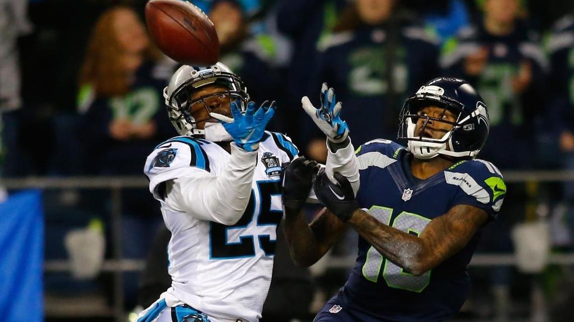 
Carolina Panthers cornerback Bené Benwikere (25) steps in front of a pass intended for Seattle Seahawks wide receiver Paul Richardson during the 2015 NFC divisional playoff game at CenturyLink Field in January. The players grew up together outside Los Angeles.


