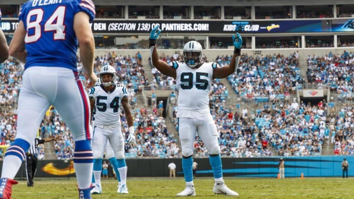 Carolina Panthers defensive end Charles Johnson (95) officially retired from the NFL on Thursday.