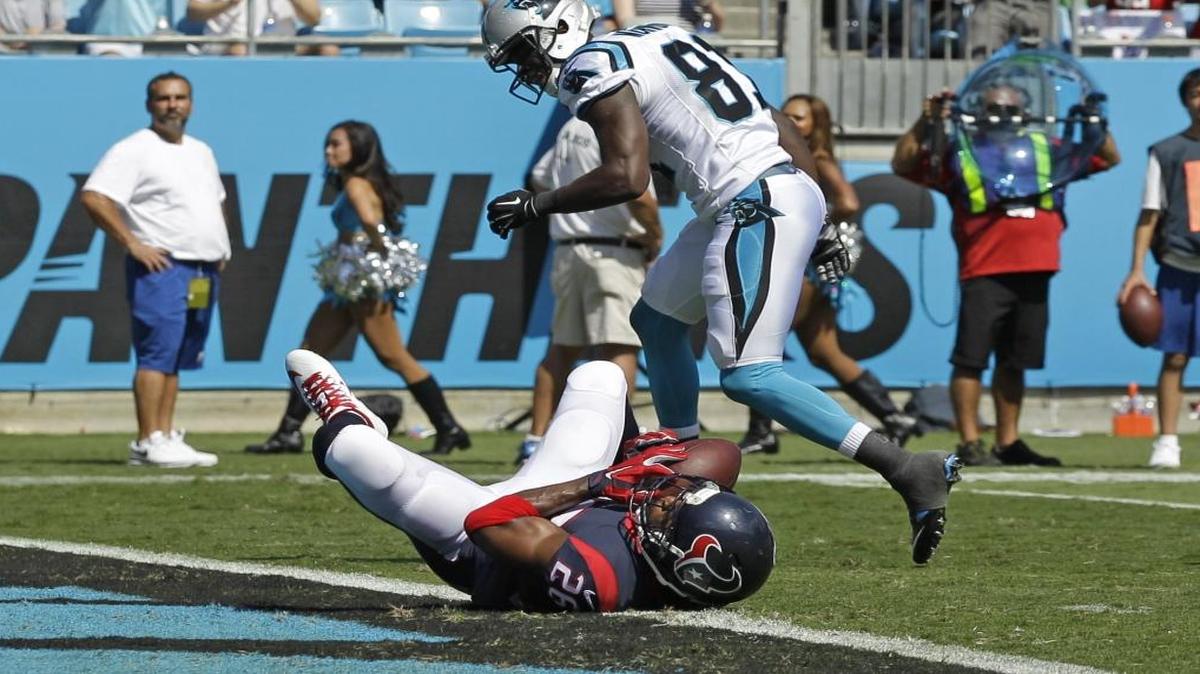 
A pass intended for Carolina Panthers receiver Kevin Norwood (81) is intercepted by Houston’s Rahim Moore (26) during Carolina’s 24-17 victory on Sunday.
