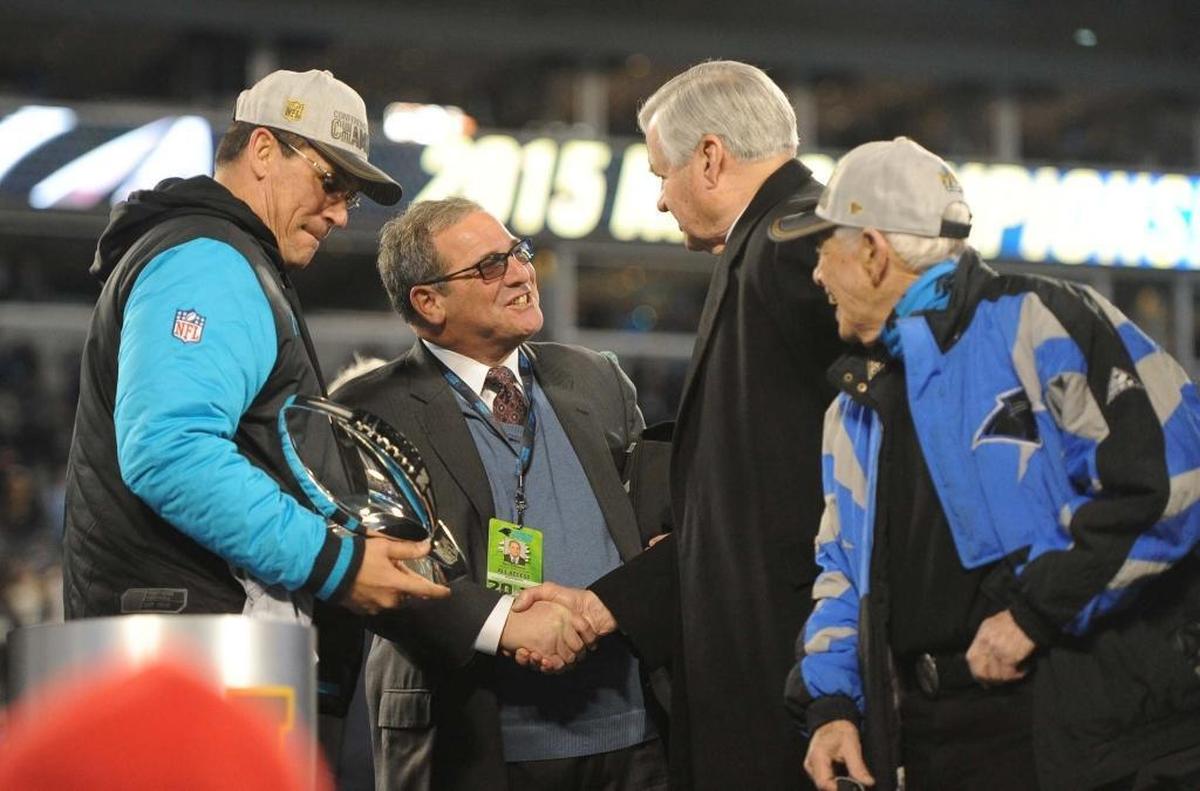In happier times: Ron Rivera, Dave Gettleman, Jerry Richardson and Richardson’s close friend, former Bank of America CEO Hugh McColl Jr., celebrate following the Panthers' 49-15 victory over the Arizona Cardinals in the NFC Championship game in Charlotte in January 2016.