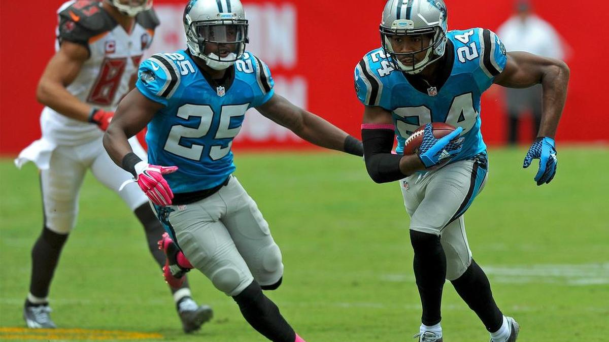 
Carolina Panthers cornerback Josh Norman, right, intercepts a pass by Tampa Bay Buccaneers quarterback Jameis Winston for a touchdown during first quarter action on Sunday. Norman also had a second interception in the game.
