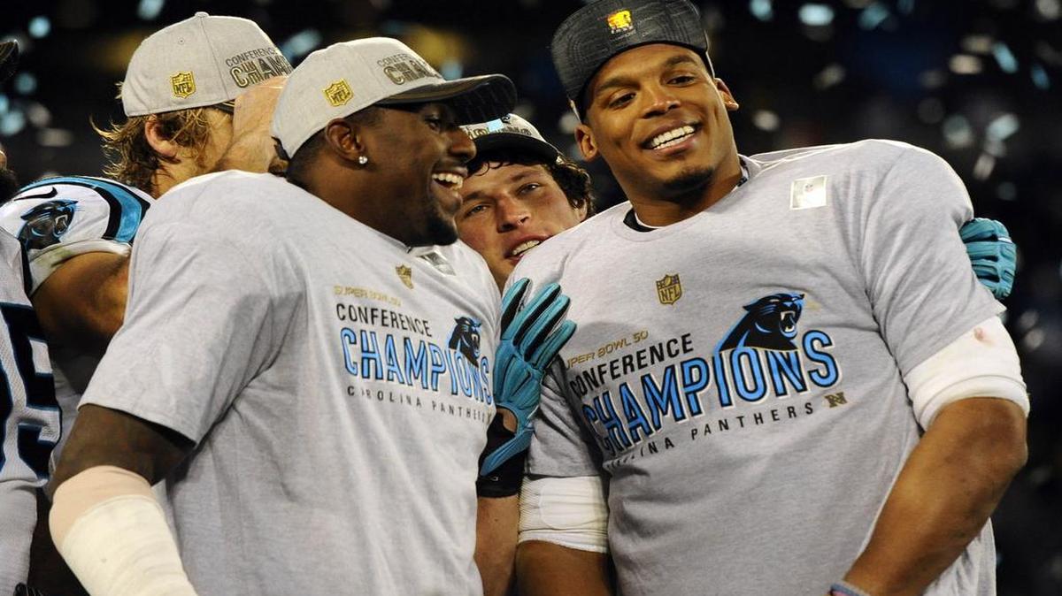 Carolina Panthers outside linebacker Thomas Davis (58), middle linebacker Luke Kuechly (59), and quarterback Cam Newton (1) smile while celebrating during the awards ceremony after the team defeated the Arizona Cardinals in the NFC Championship game at Bank of America Stadium on Sunday, January 24, 2016.