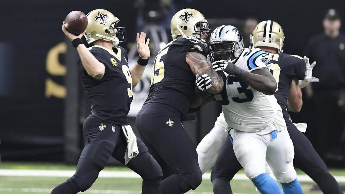 New Orleans quarterback Drew Brees (left) -- a rival of the Carolina Panthers for more than a decade -- will try to lead his Saints into the Super Bowl on Sunday at home against the L.A. Rams.