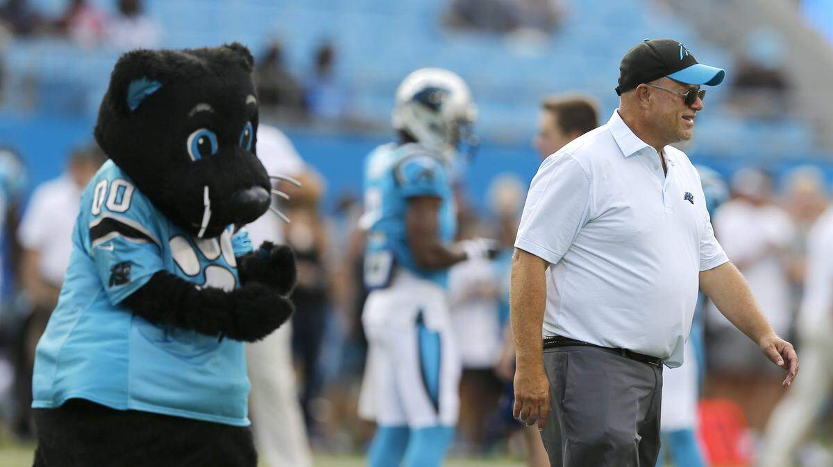Carolina Panthers owner David Tepper, right, watches his team warm up before a preseason NFL football game against the Miami Dolphins in Charlotte, N.C., Friday, Aug. 17, 2018. (AP Photo/Nell Redmond)