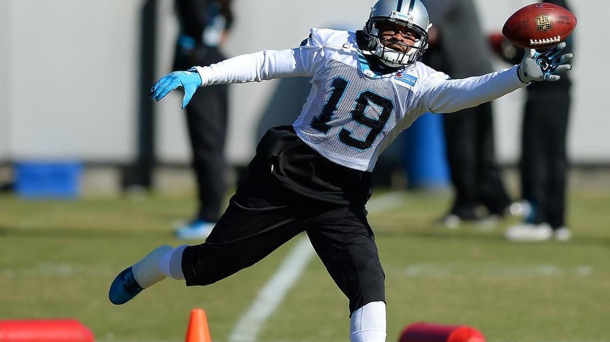 Carolina Panthers wide receiver Ted Ginn, Jr. reaches out in an attempt to get his left hand on a pass during practice on Thursday, January 14, 2016.