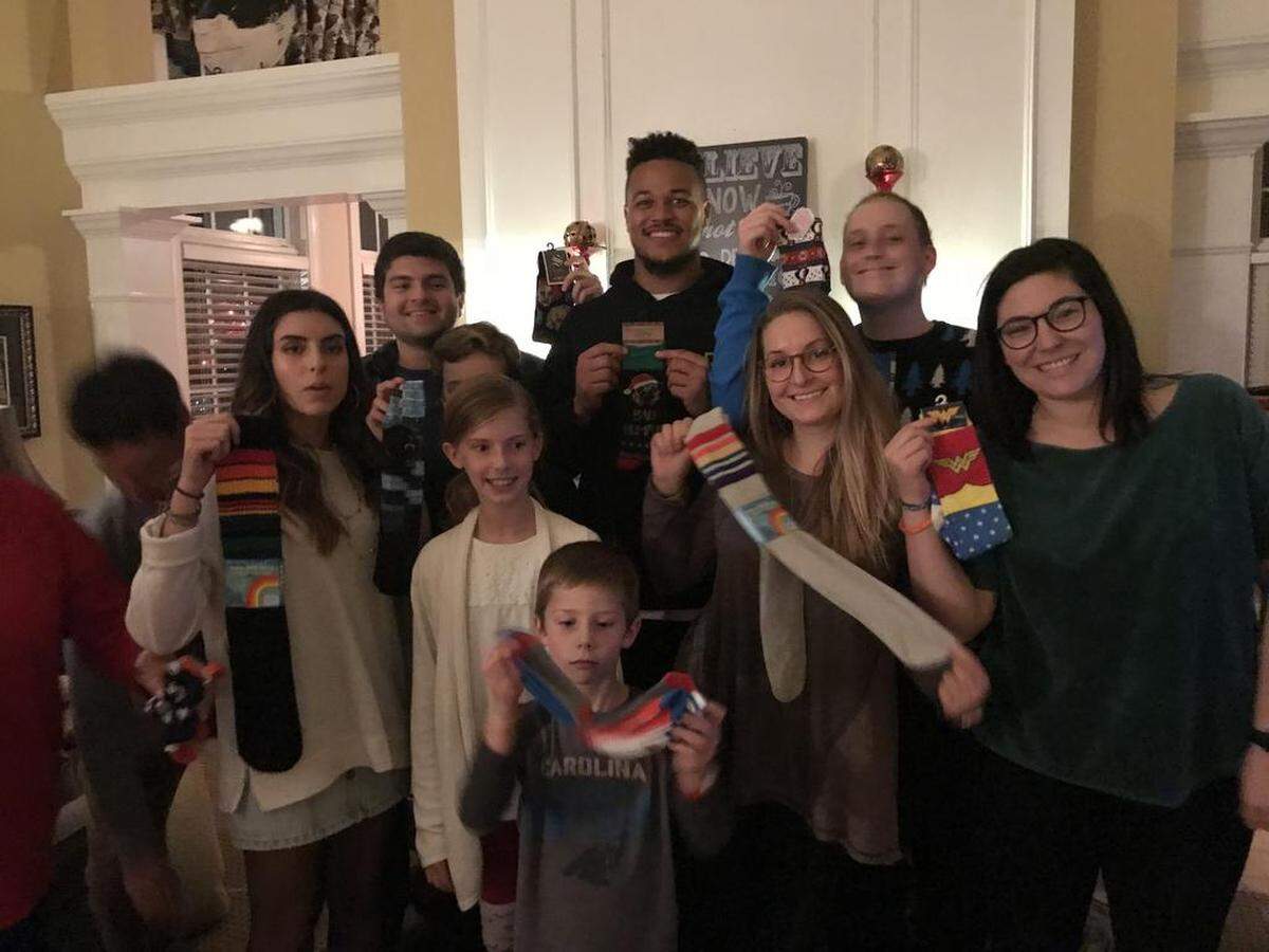 Noah Hays, Wes Horton and Hays' large family at Christmas, when the family does its annual sock exchange.