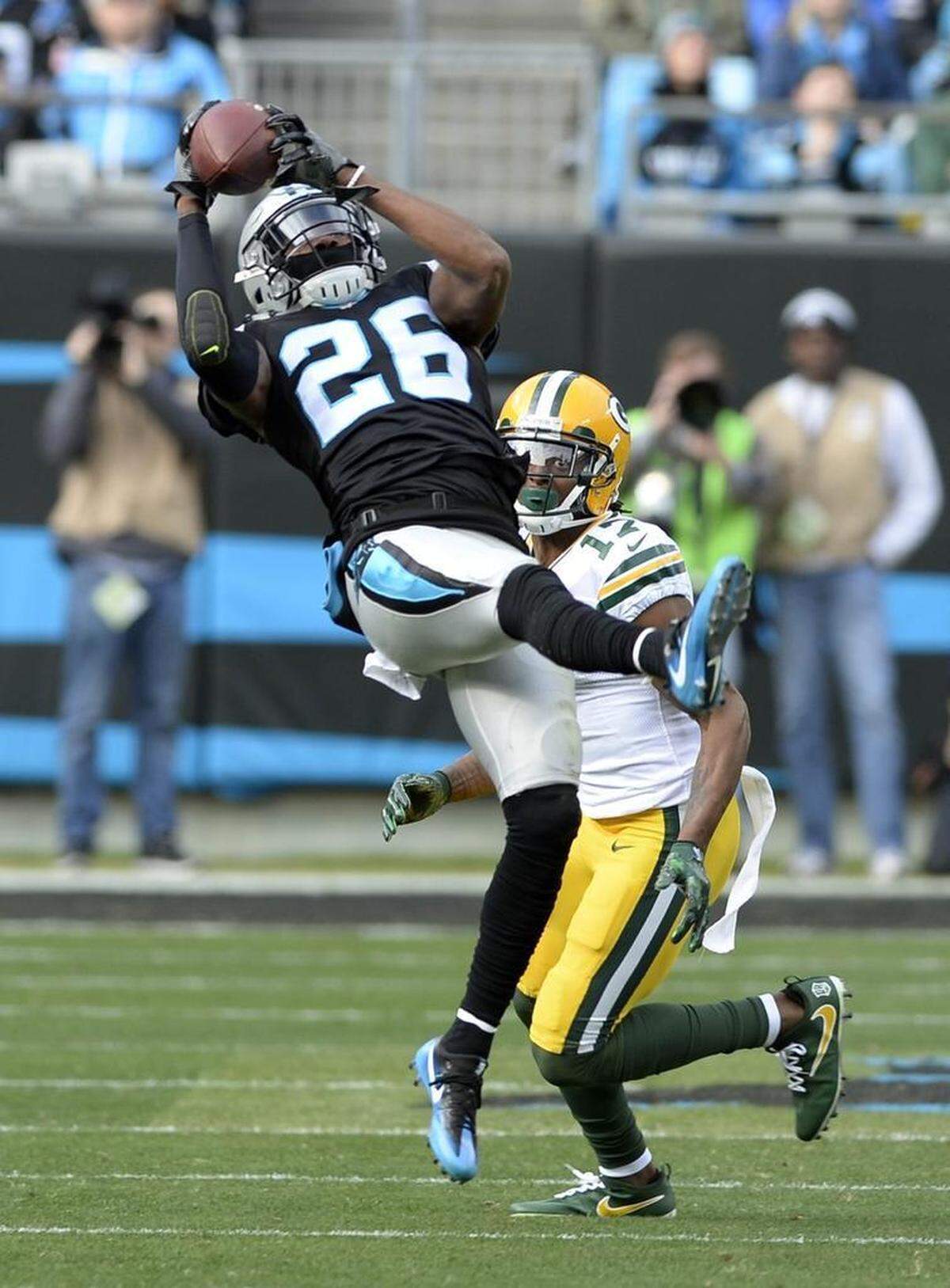 Carolina Panthers cornerback Daryl Worley (26) intercepts an Aaron Rodgers pass intended for Green Bay Packers wide receiver Davante Adams (17) at Bank of America Stadium on Sunday, Dec. 17, 2017.