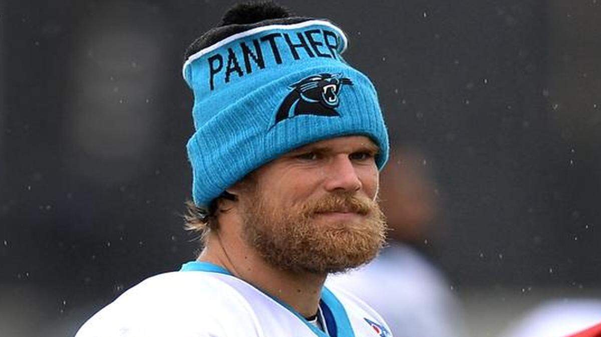 Carolina Panthers tight end Greg Olsen, left, is the team’s nominee for the Walter Payton NFL Man of the Year award for 2015.