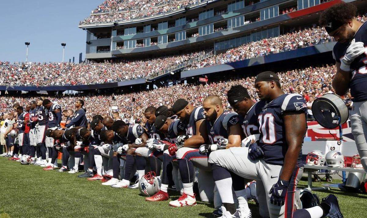 Some New England Patriots players kneel during the national anthem before last Sunday’s home game against the Houston Texans in Foxborough, Mass. The Patriots won 36-33.