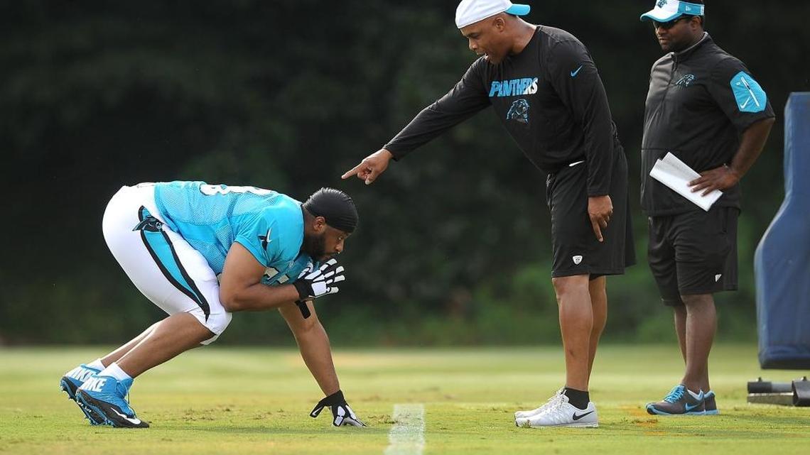 Carolina Panthers defensive end Wes Horton, left, has been suspended four games under the NFL’s performance enhancing drug policy.