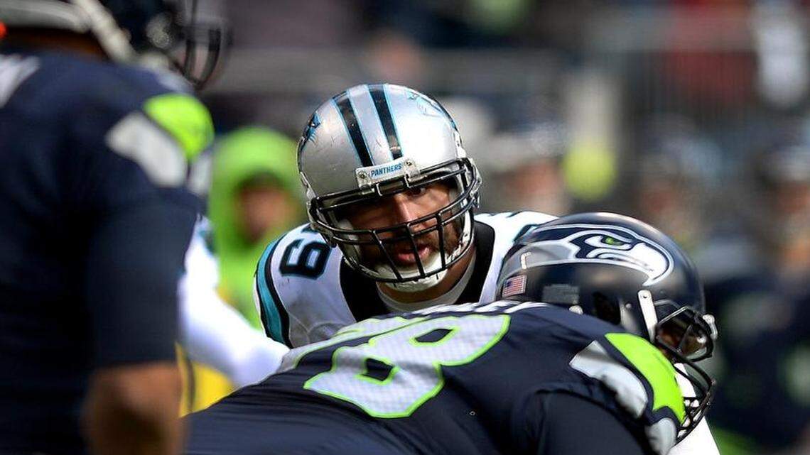 Carolina Panthers defensive end Jared Allen lines up across from the Seattle Seahawks offensive line as quarterback Russell Wilson calls a play during the second quarter. Allen suffered a foot injury and is doubtful for Sunday’s NFC Championship Game.