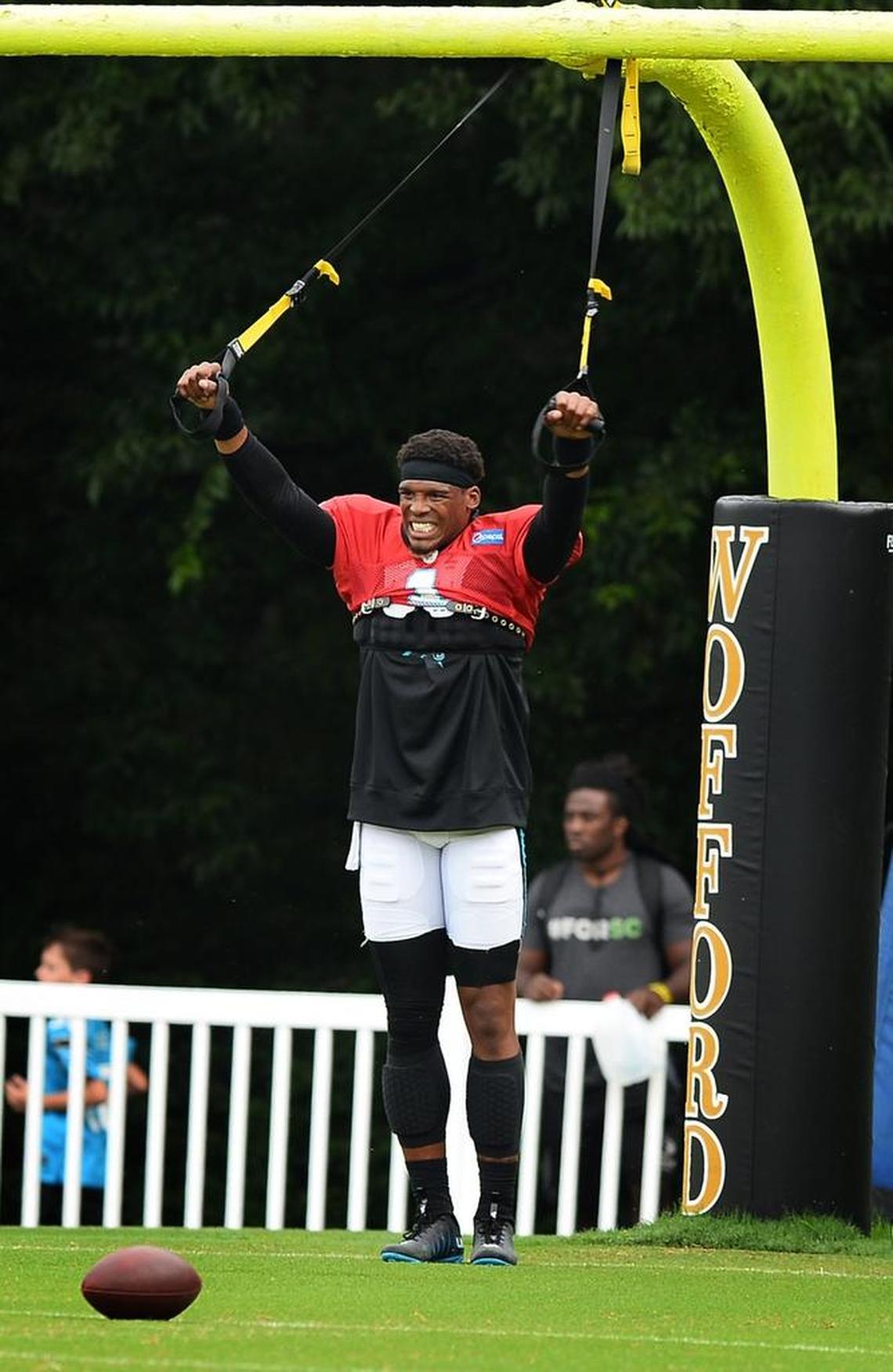 Carolina Panthers quarterback Cam Newton stretches before practice at Wofford College in Spartanburg on Wednesday. Newton was limited as he continues to rehab his surgically repaired throwing shoulder.