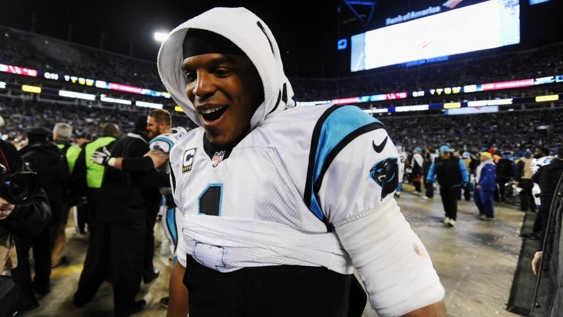 Carolina Panthers quarterback Cam Newton (1) heads to the stands to celebrate with fans near the end of the NFC Championship Game victory over the Arizona Cardinals.
