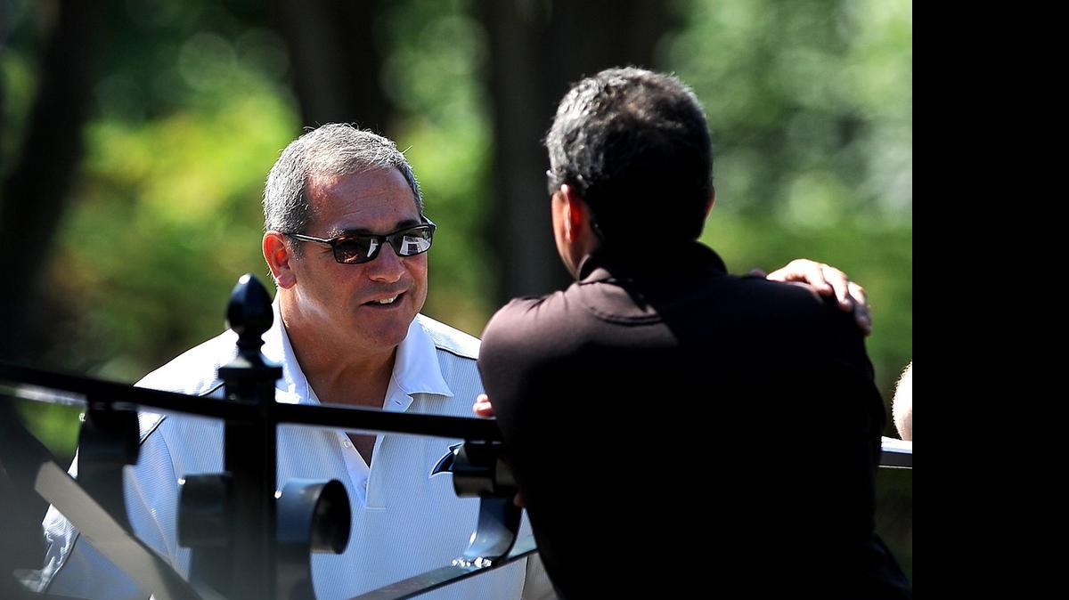 
Carolina Panthers general manager Dave Gettleman stops and talks with fans Wednesday prior to the team’s minicamp practice.
