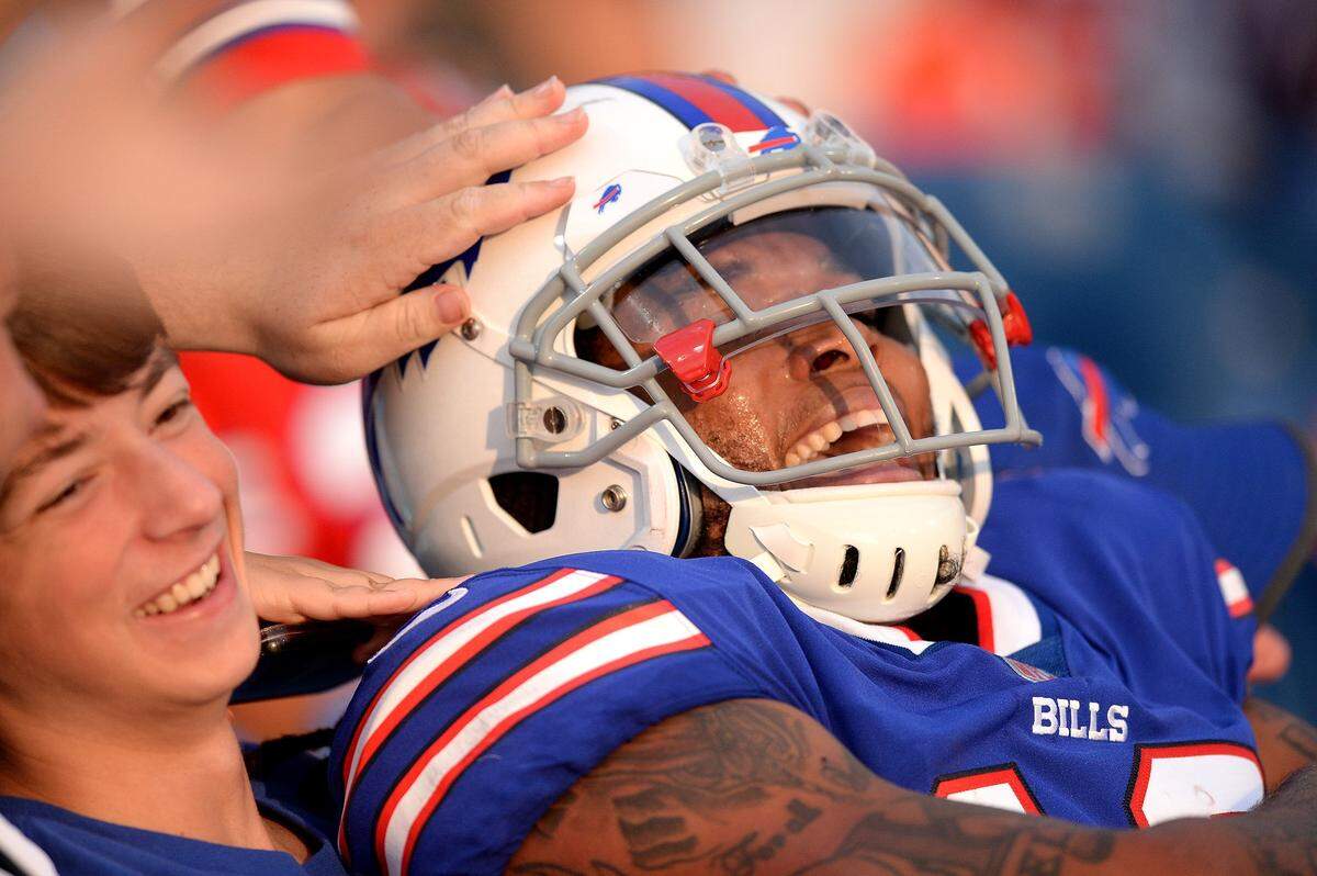 Buffalo Bills wide receiver Kelvin Benjamin celebrates his touchdown pass reception by sitting in the front row of the stands with the fans during NFL exhibition action against the Carolina Panthers at New Era Field in Orchard Park, NY on Thursday, August 9, 2018.
