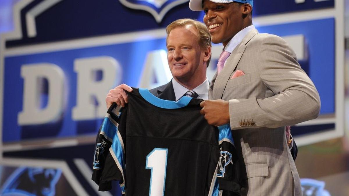 Auburn Quarterback Cam Newton, right, holds up a jersey with NFL commissioner Roger Goodell after he was selected as the No. 1 overall pick by the Carolina Panthers on April 28, 2011, in New York.