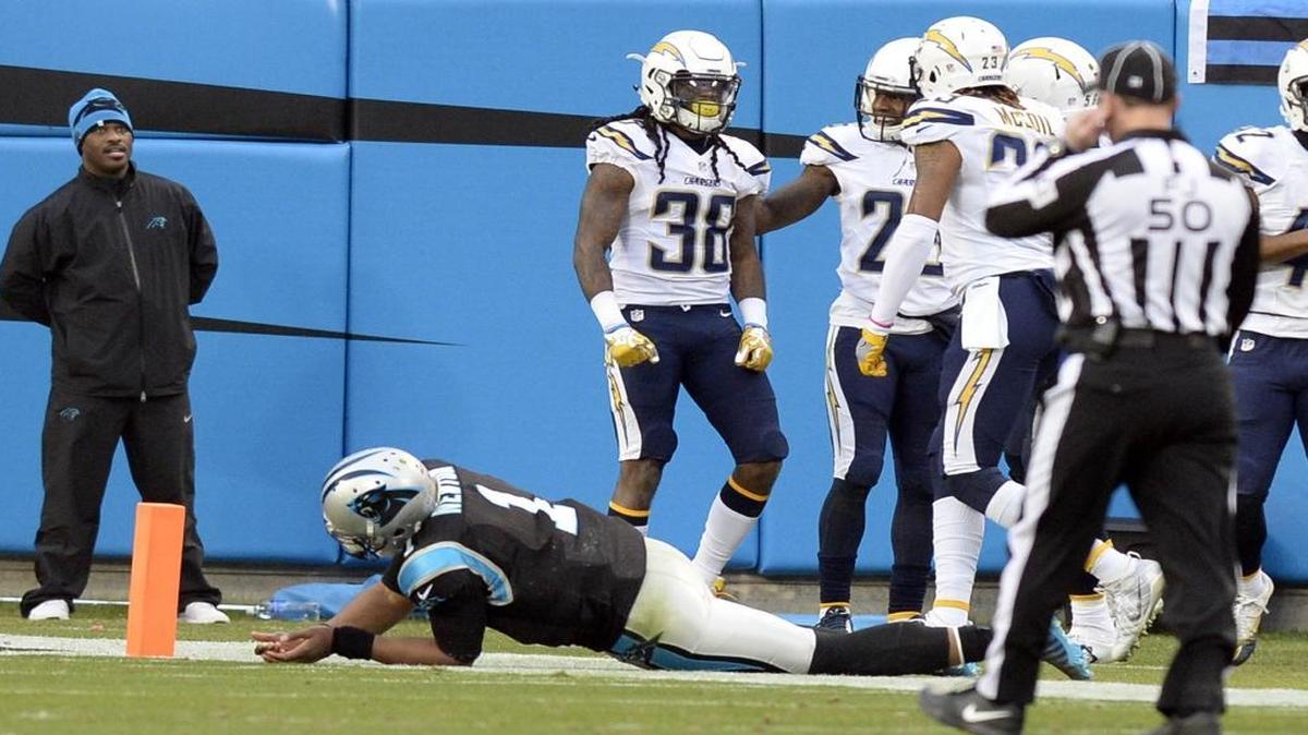 Carolina Panthers quarterback Cam Newton (1) is believed to have injured his shoulder on this play, when he chased down San Diego Chargers cornerback Trovon Reed (38) on an interception that was returned for a touchdown.