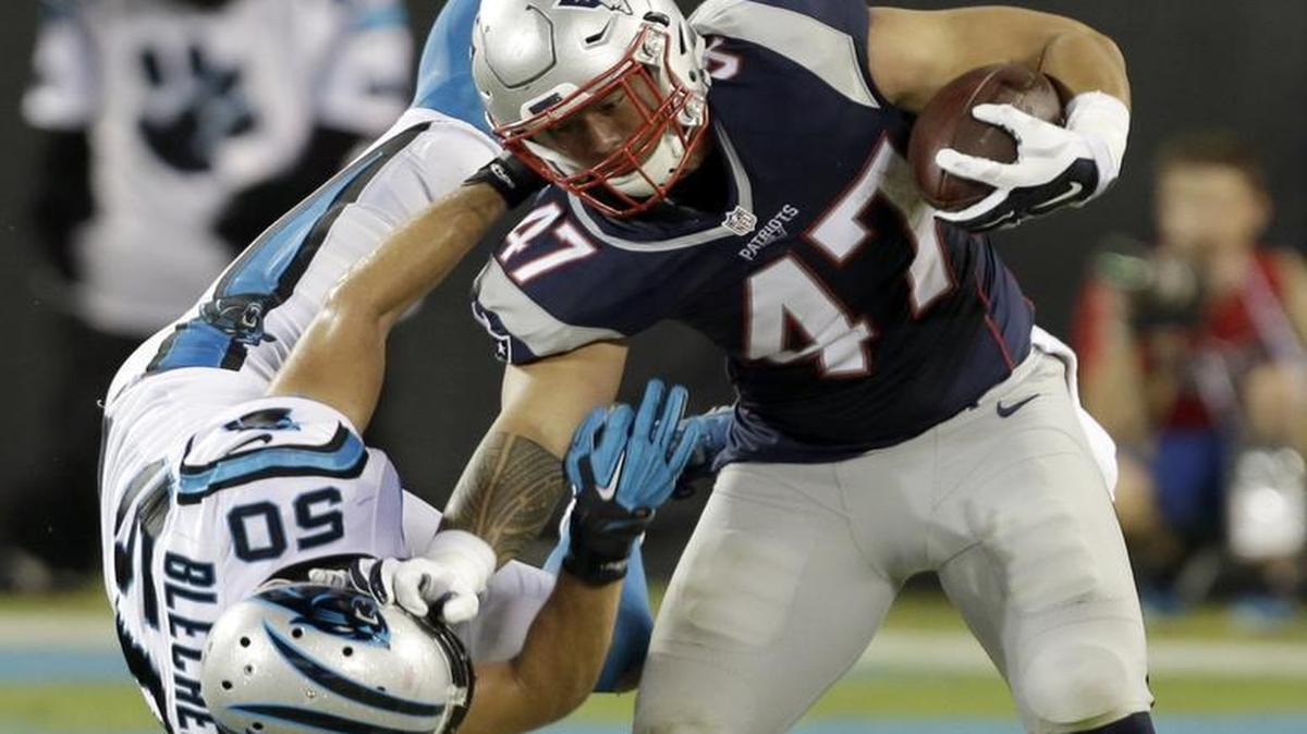 Carolina Panthers linebacker Brian Blechen (50) tries to tackle New England’s Joey Iosefa during the second half of Friday’s exhibition in Charlotte. Injuries forced Blechen to play strong safety against the Patriots.