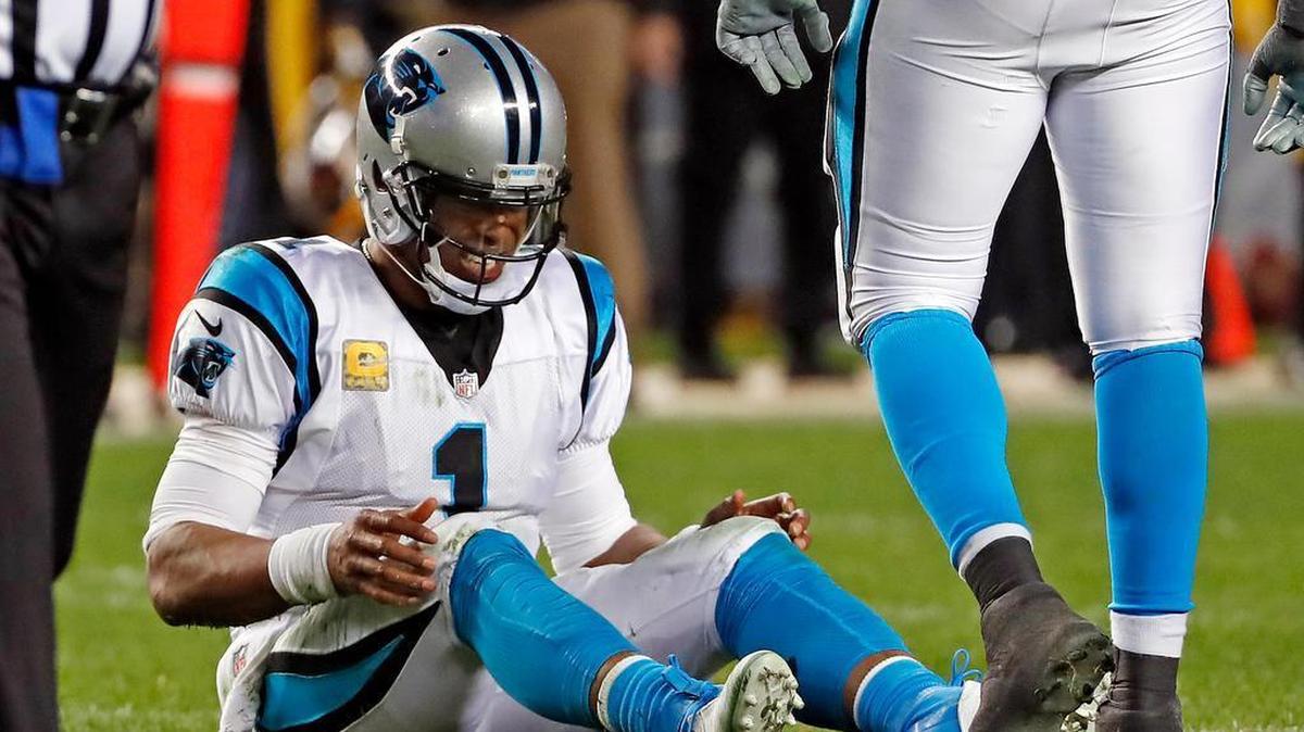 Carolina Panthers quarterback Cam Newton (1) collects himself after fumbling the ball after being hit by Pittsburgh outside linebacker T.J. Watt (90) Thursday night. The Panthers suffered a lopsided defeat, allowing Steelers quarterback Ben Roethlisberger to finish with more TD passes (five) than incompletions (three).