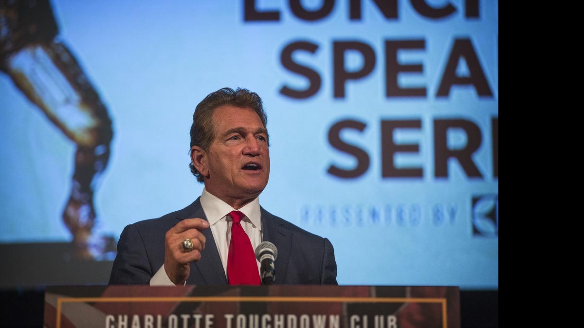 
Former NFL quarterback Joe Theismann speaks at a luncheon held by the Charlotte Touchdown Club on Friday, June 19, 2015.
