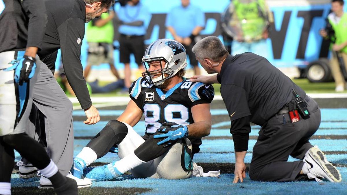 Carolina Panthers' Greg Olsen (88) is checked on by training staff while playing against the Atlanta Falcons late in the second quarter at Bank of America Stadium on Sunday, December 13, 2015. The Panthers won, 38-0.
