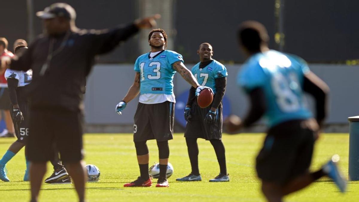 The Carolina Panthers' Kelvin Benjamin (13) (Right) and Devin Funchess (17) (Left) stand before a drill at practice on Wednesday, June 14.