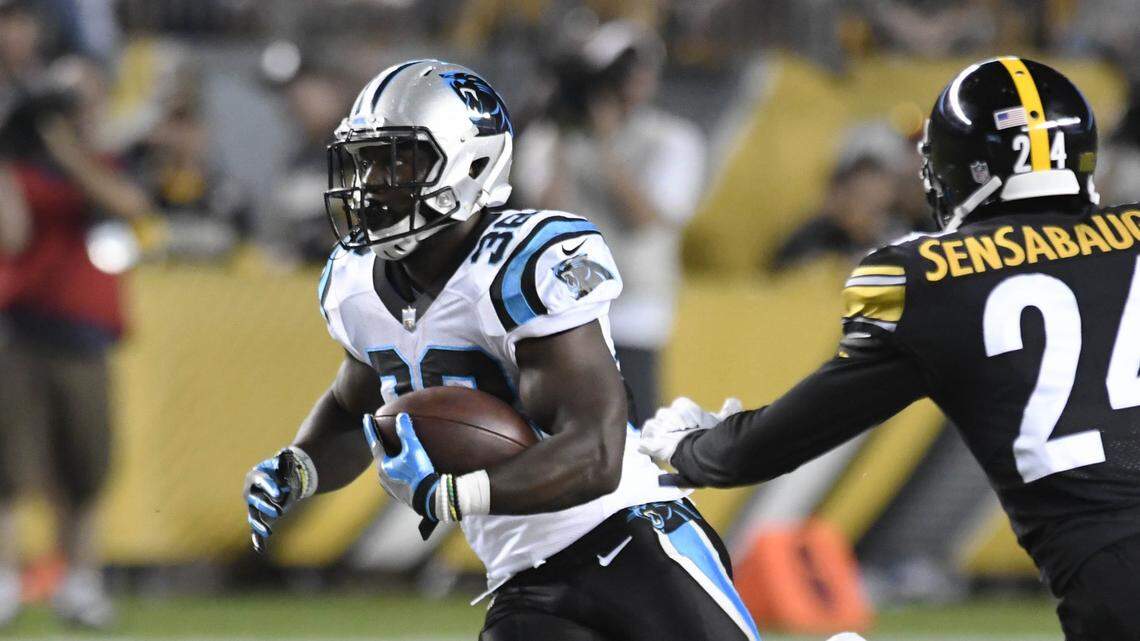Carolina Panthers running back Kenjon Barner (38) kids running room as Pittsburgh Steelers defensive back Coty Sensabaugh (24) closes in during the first half during the last game of the preseason at Heinz Field on Thursday, August 30, 2018.