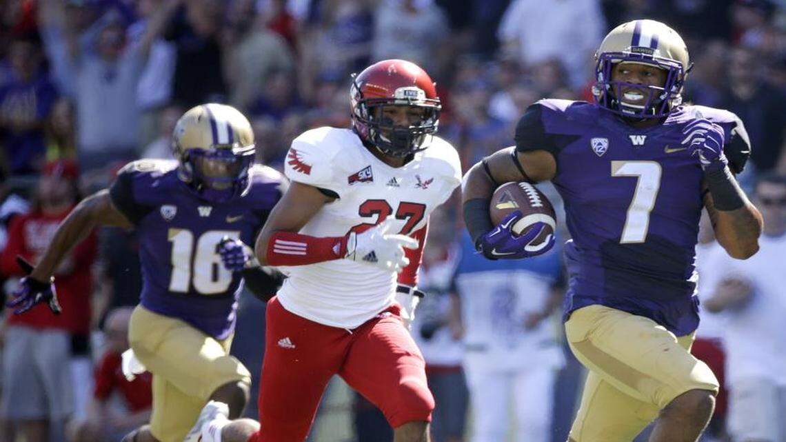 
Washington linebacker Shaq Thompson (7) had six touchdowns for the Huskies in 2014, including two at running back. His best NFL position, based on his size and strength, could be safety. 
