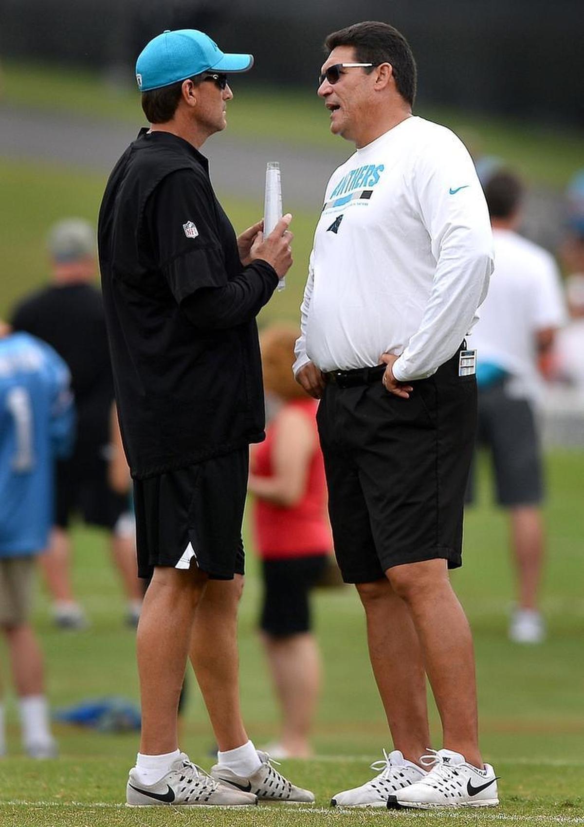 The Carolina Panthers’ struggles on offense have raised questions about offensive coordinator Mike Shula (left) and his system, but not for head coach Ron Rivera, right.