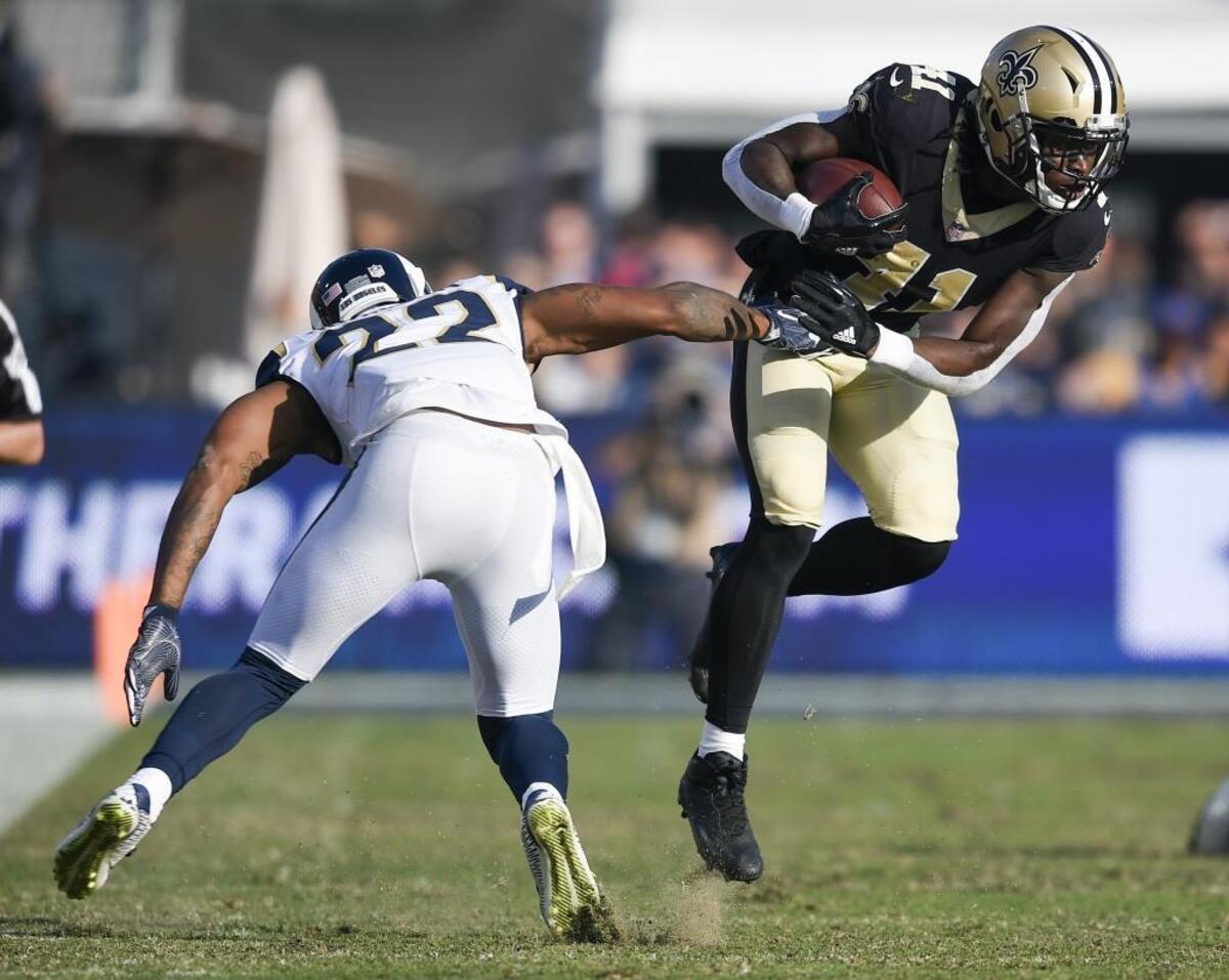 New Orleans Saints running back Alvin Kamara (41), like Carolina Panthers rookie Christian McCaffrey, can make tacklers miss, but the two accomplish that in very different ways.