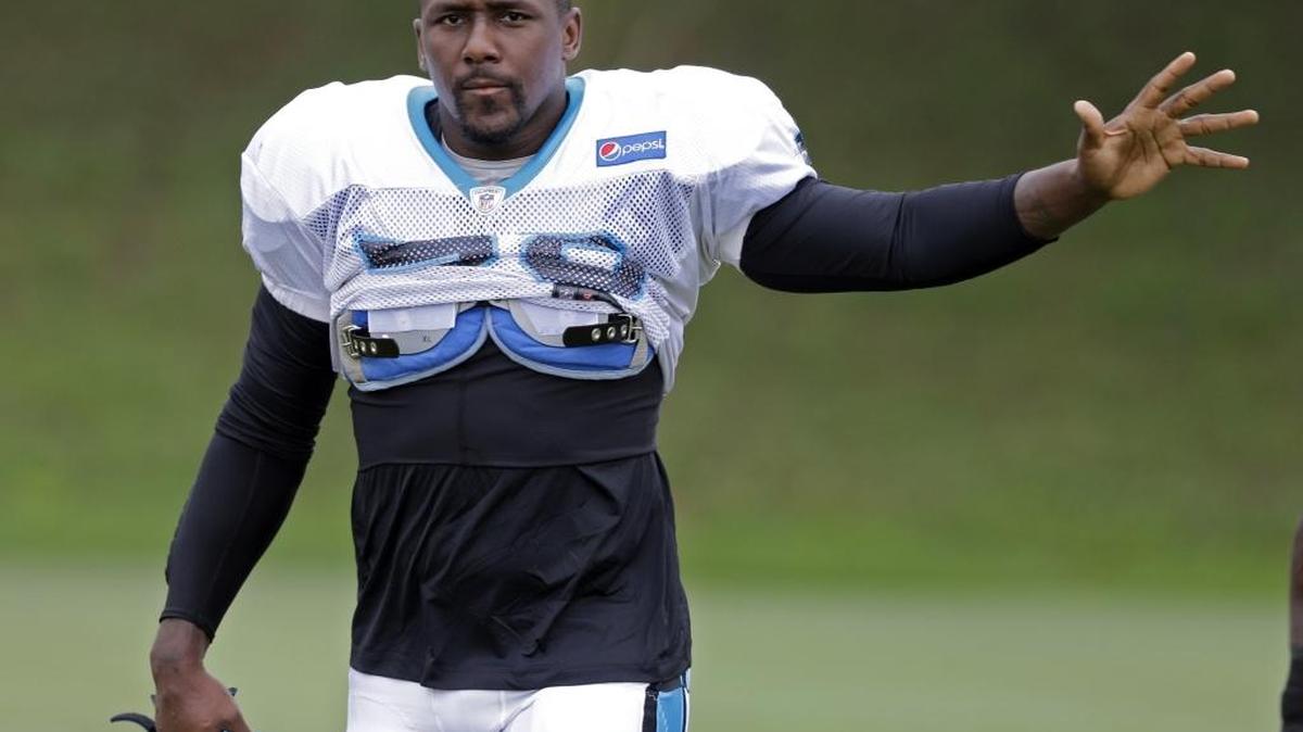 Carolina Panthers linebacker Thomas Davis waves to the crowd during training camp Monday. Camp ended Tuesday with Davis missing out on any Cam Newton interceptions, but he said the challenge will continue.