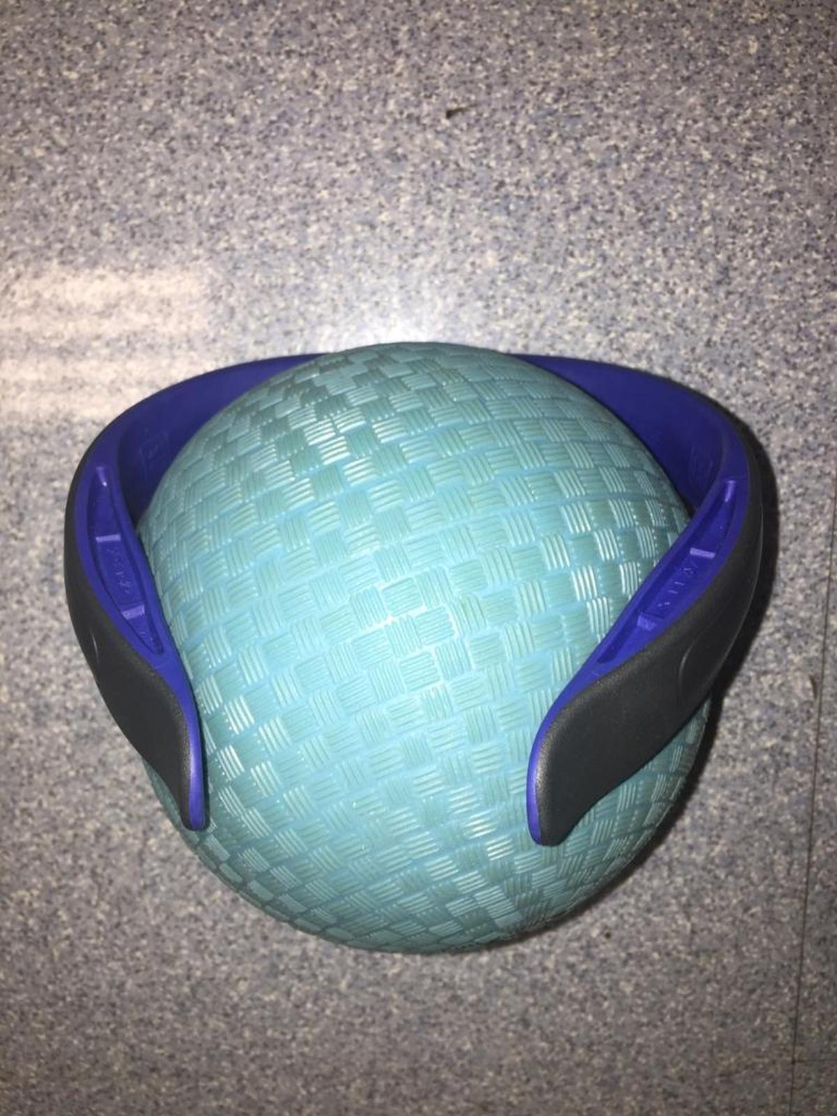 An example of the Q Collar worn by high school football players at Cincinnati St. Xavier, Panthers linebacker Luke Kuechly’s alma mater, and now Kuechly himself. Researchers are studying the collar’s potential benefits in limiting concussions and brain injuries in contact sports.