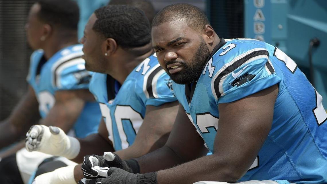 The Carolina Panthers released tackle Michael Oher, right, on Thursday. Oher missed the final 13 games of the 2016 season while in the concussion protocol.