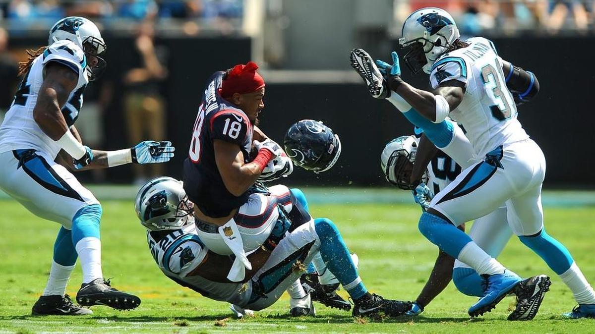 
Carolina Panthers safety Kurt Coleman makes the tackle on Houston Texans wide receiver Cecil Shorts III as he loses his helmet during first quarter action at Bank of America Stadium in Charlotte on Sunday. Panthers linebacker Shaq Thompson, left, cornerback Charles Tillman, right, and linebacker Thomas Davis right/back watch the play. The Panthers defeated the Texans 24-17.

