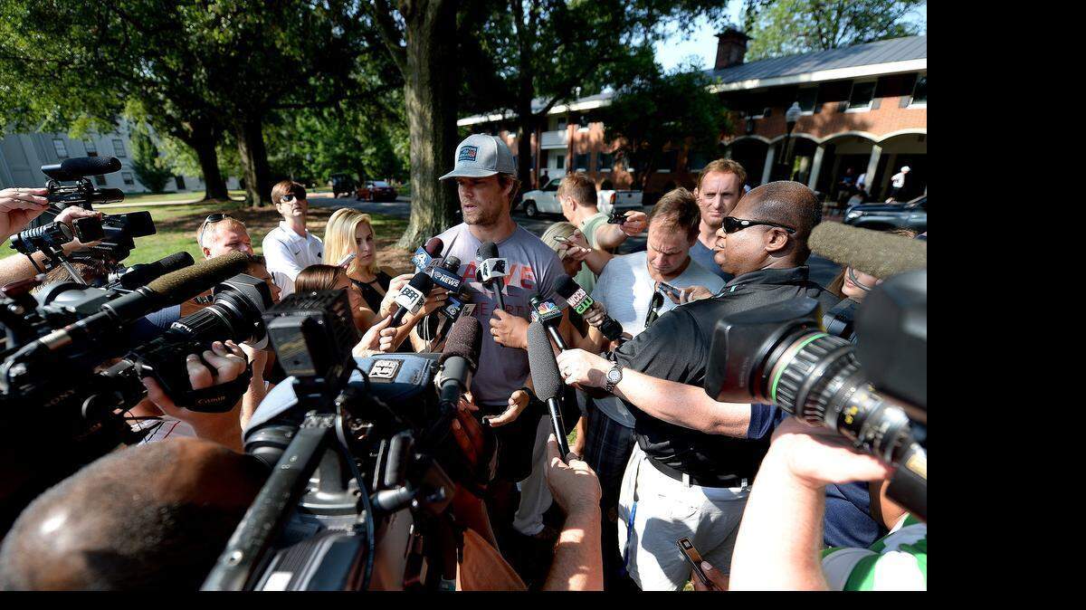 
Carolina Panthers tight end Greg Olsen, center, said Thursday in Spartanburg that he thinks the fuss surrounding Tom Brady and deflated footballs is overblown. 

