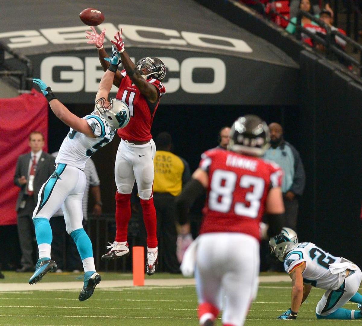 Falcons wide receiver Julio Jones leaps over Carolina Panthers linebacker Luke Kuechly for a deep pass reception from quarterback Matt Ryan in 2015, when the Falcons ruined Carolina’s dream of a perfect season in Atlanta.