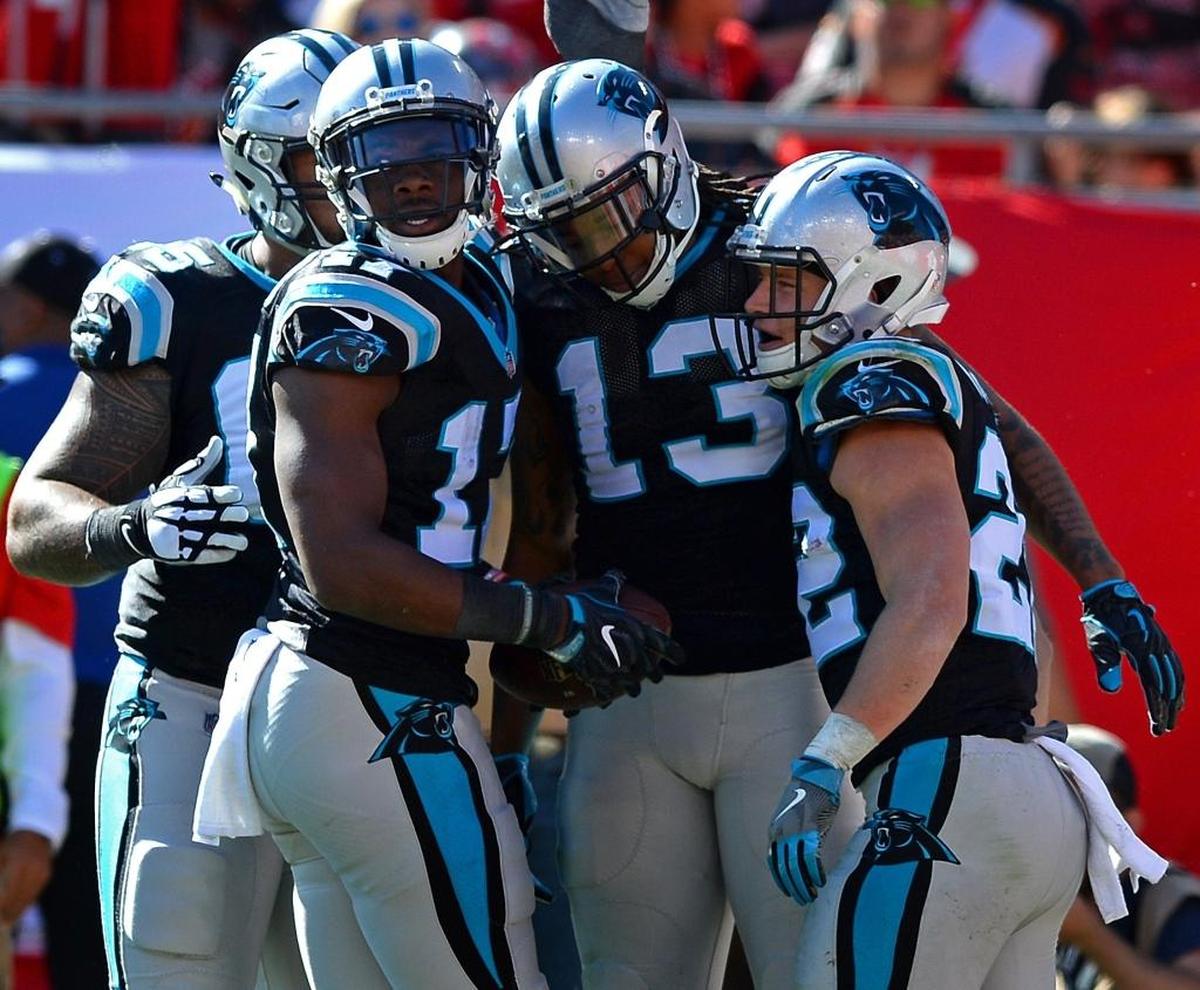 Carolina Panthers wide receiver Kelvin Benjamin, center, is congratulated by his teammates after catching a touchdown pass against Tampa Bay Sunday. Benjamin’s 25-yard TD grab was the only play over 20 yards the Panthers offense had the entire afternoon in a 17-3 Carolina win.