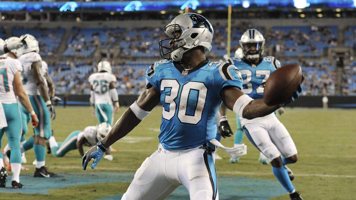 Carolina Panthers’ Elijah Hood (30) celebrates his touchdown against the Miami Dolphins in the second half of a preseason NFL football game in Charlotte, N.C., Friday, Aug. 17, 2018. (AP Photo/Mike McCarn)