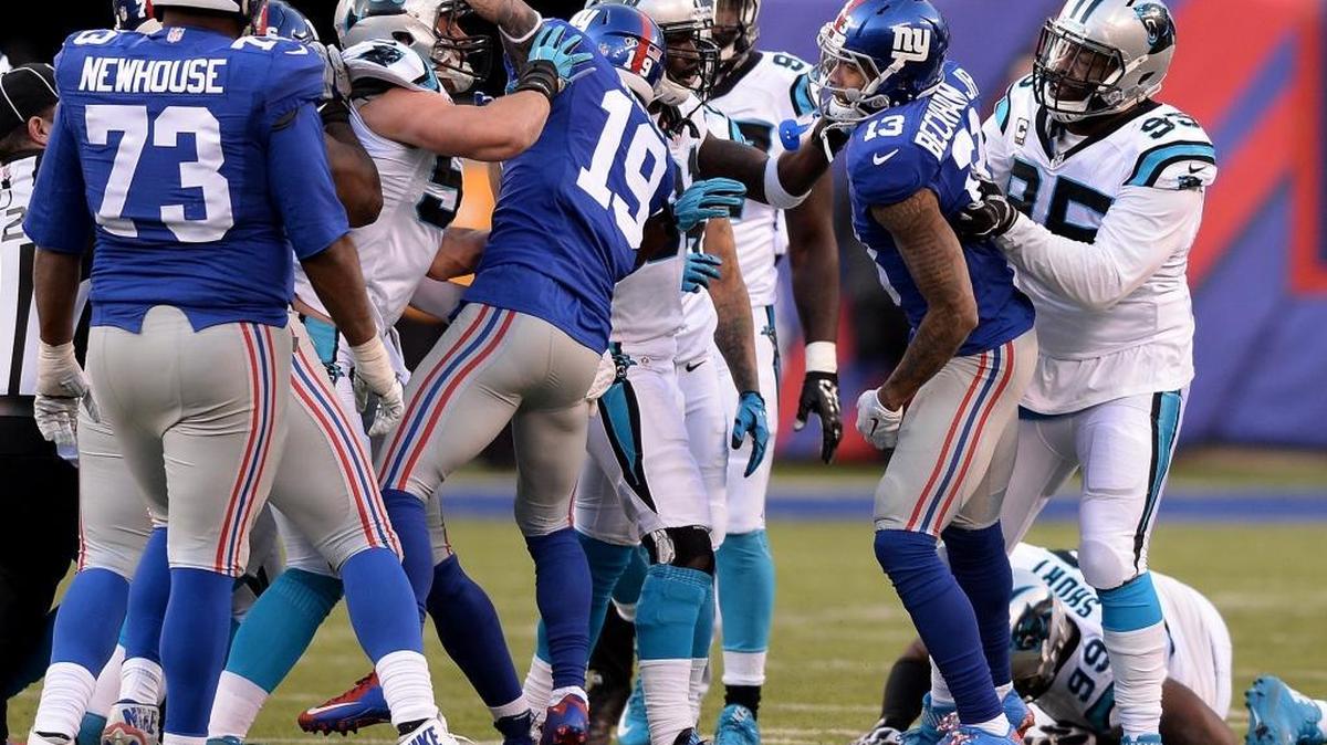 The NFL’s automatic ejection rule, approved Wednesday at the NFL meetings in Florida, covers fouls for throwing a punch at or kicking an opponent, taunting and using abusive or threatening language. It does not cover the flagrant fouls that marred the Giants-Panthers regular-season game (above).