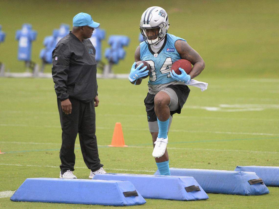 Carolina Panthers running back Cameron Artis-Payne (34) runs through obstacles during organized team activities on Tuesday, May 29, 2018
