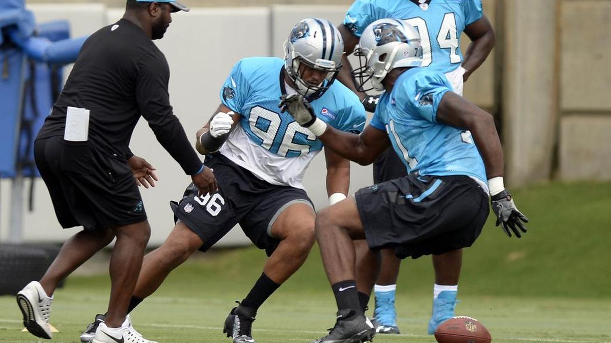 Carolina Panthers defensive end Wes Horton (96) turns back toward the ball during a drill on Monday at the team's practice facility near Bank of America Stadium.